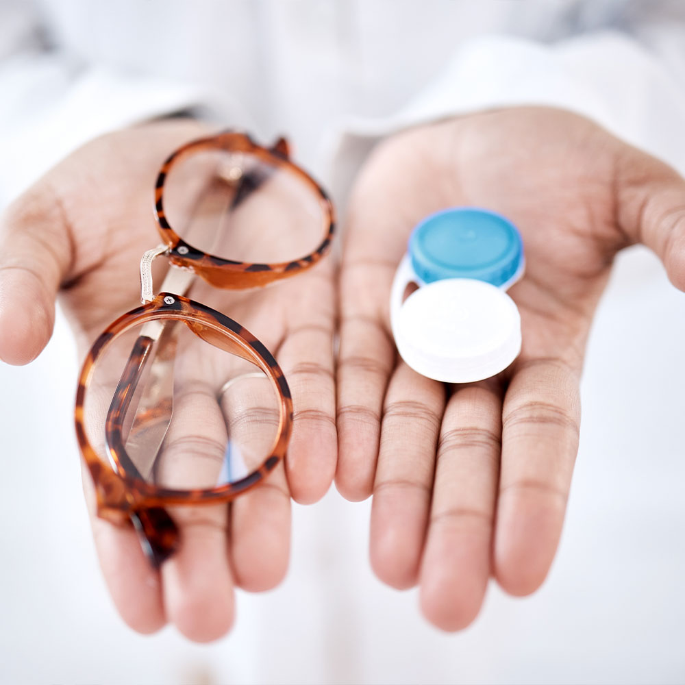 A dental professional is assisting a patient with a digital display of the patient s mouth, highlighting dental work in progress.